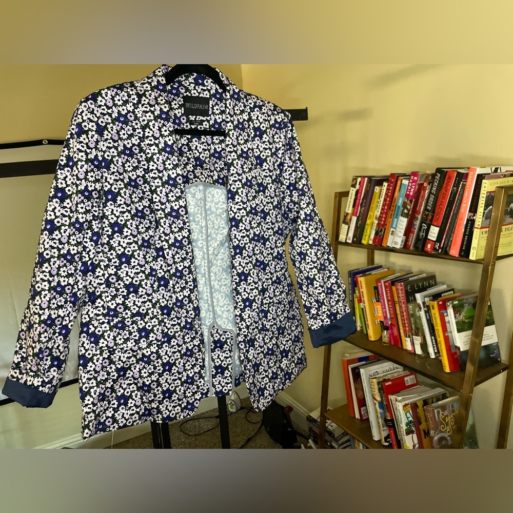 A blazer is a type of jacket resembling a suit jacket, but cut more casually.